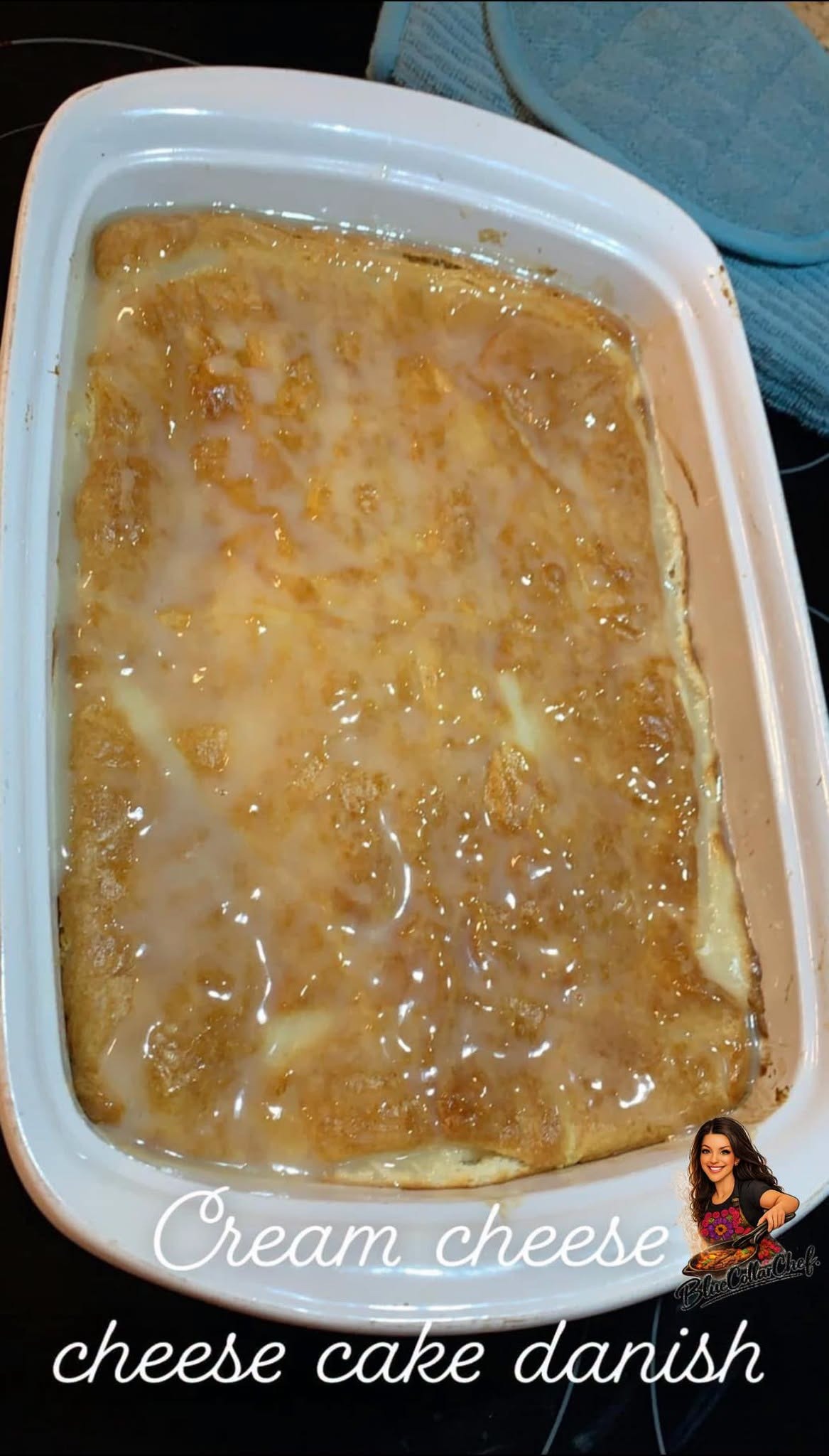 A rectangular baking dish filled with golden brown cream cheese cheesecake danish, covered in shiny glaze. The words “Cream cheese cheesecake danish” are written over the image.