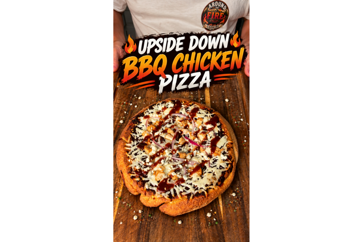 A person sits at a table with an upside-down BBQ chicken pizza topped with cheese, red onion, and barbecue sauce. The image has bold text reading Upside Down BBQ Chicken Pizza with flame graphics.