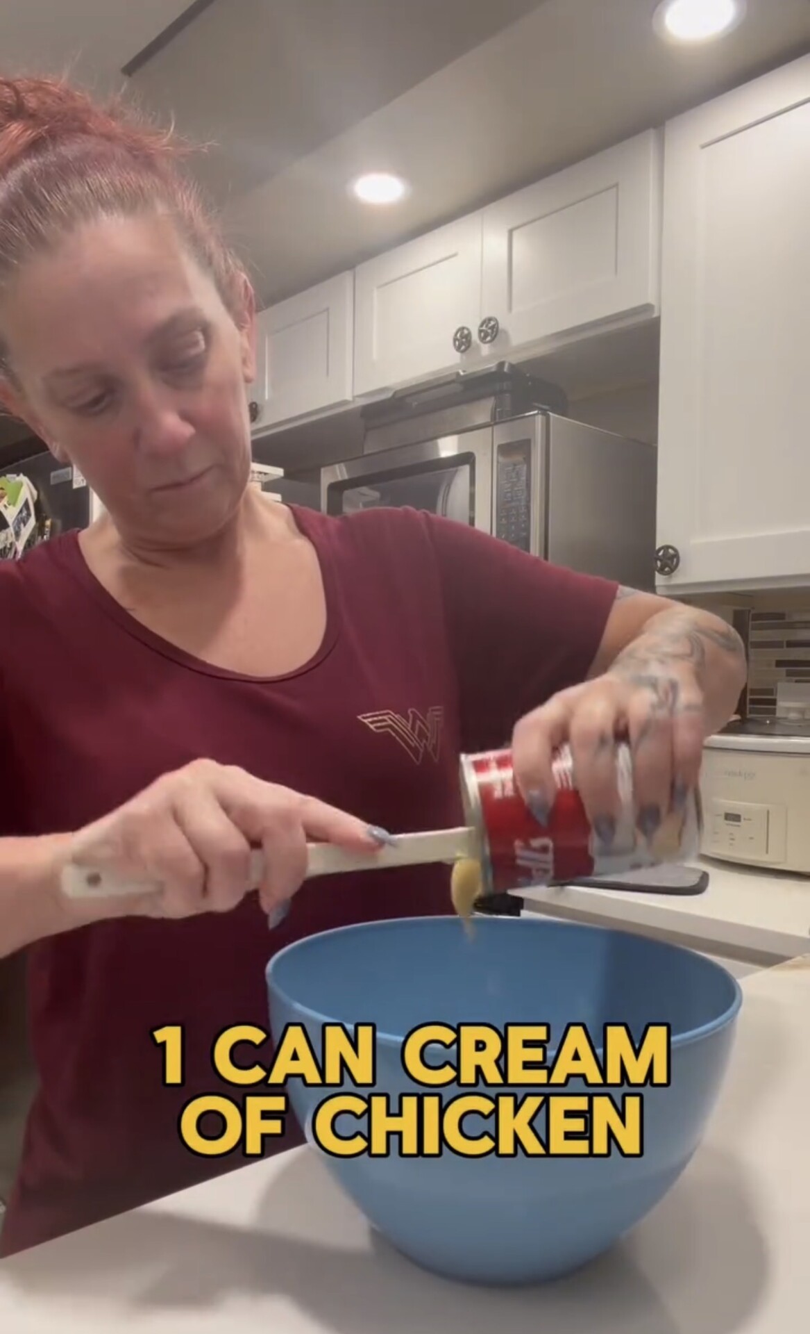 A person in a maroon shirt empties a can of cream of chicken soup into a blue mixing bowl, with text overlay reading 1 CAN CREAM OF CHICKEN.