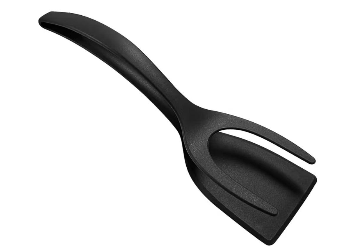Black kitchen spatula with a slotted head.